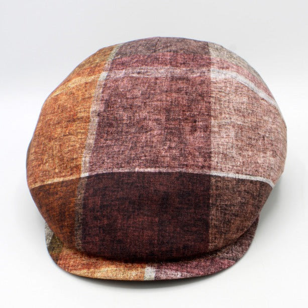 The "Big Plaid - Reds” Flat Cap by Hologramme Paris