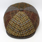 Harris Tweed cap with a patchwork pattern on a white background