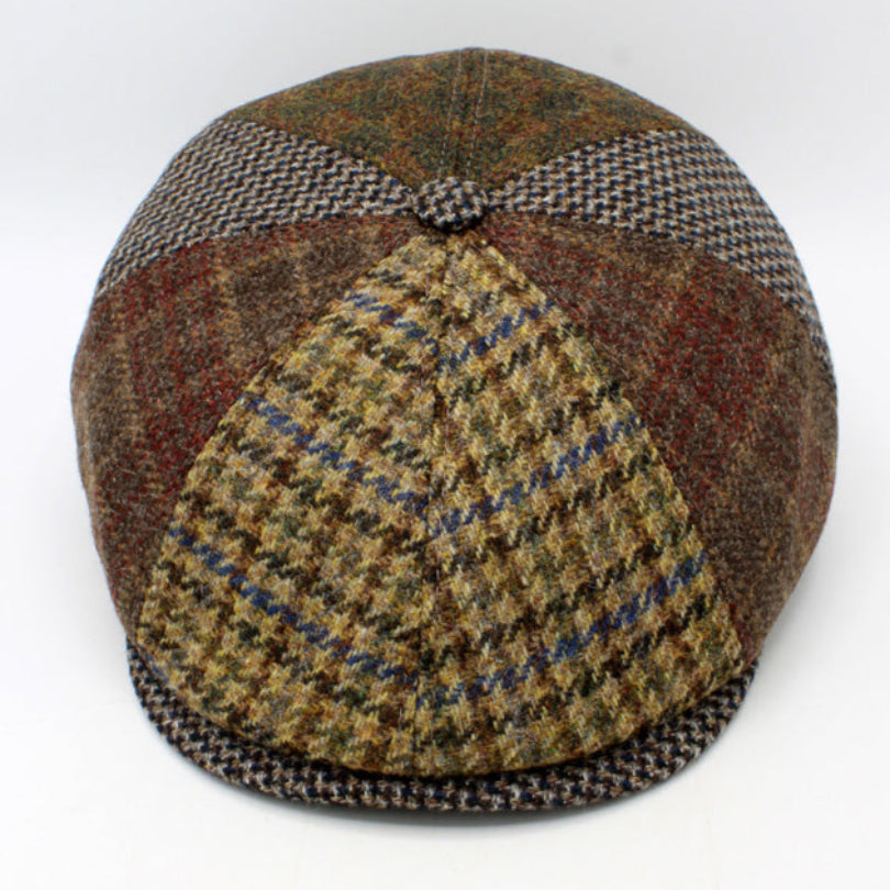 Harris Tweed cap with a patchwork pattern on a white background
