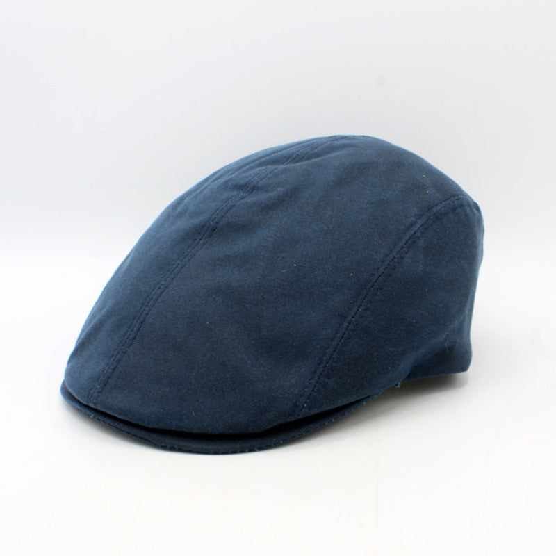 Blue flat cap on a white background